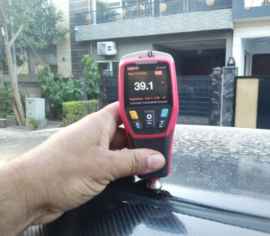 Paint gauge reading far above factory — a repainted roof sold as “original paint”