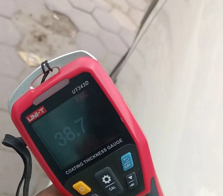 Paint-depth meter reading FAIL on a car panel